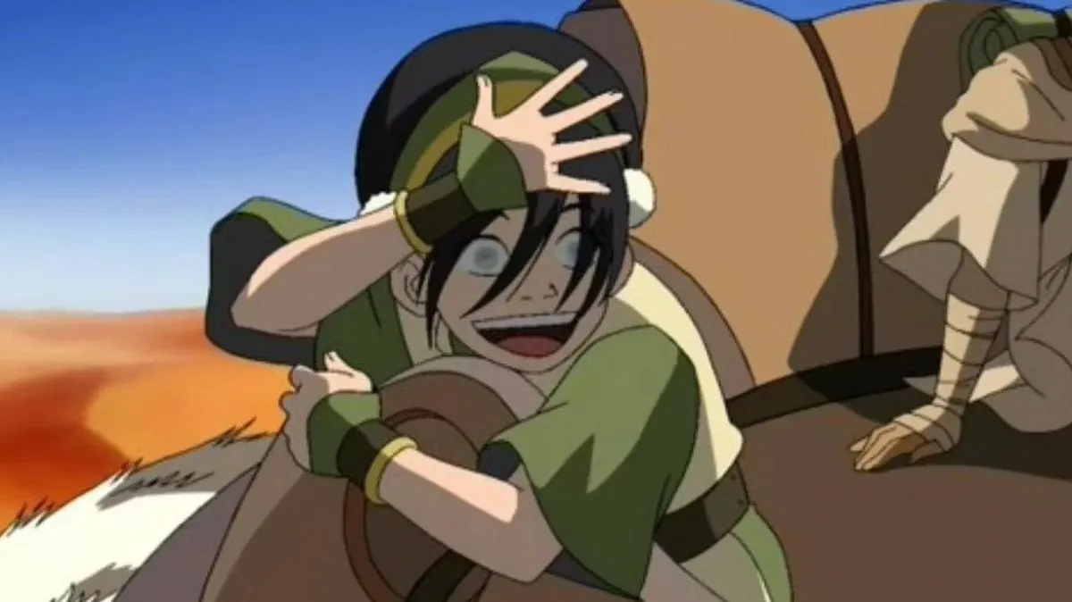 Toph waving her hand in front of her face in Avatar: The Last Airbender.