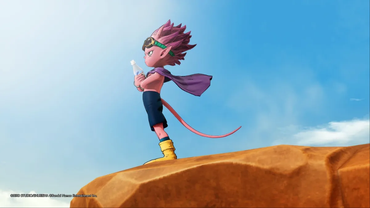 Sand Land screenshot of Beelzebub holding a bottle of water while standing atop a cliff