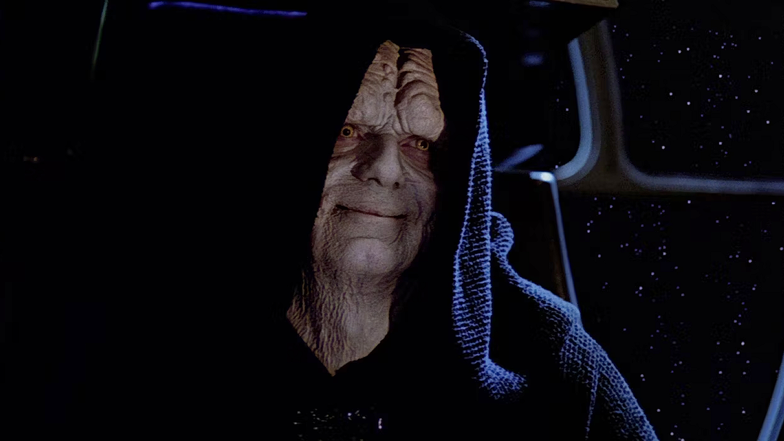 A close-up of Emperor Palpatine smiling in Star Wars: Return of the Jedi