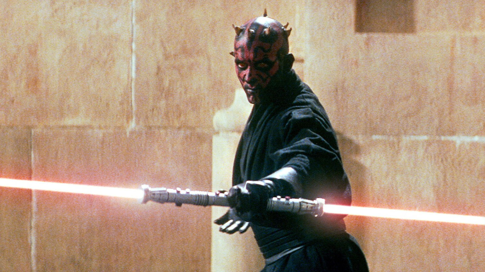 Darth Maul ignites his double-bladed lightsaber in Star Wars: The Phantom Menace
