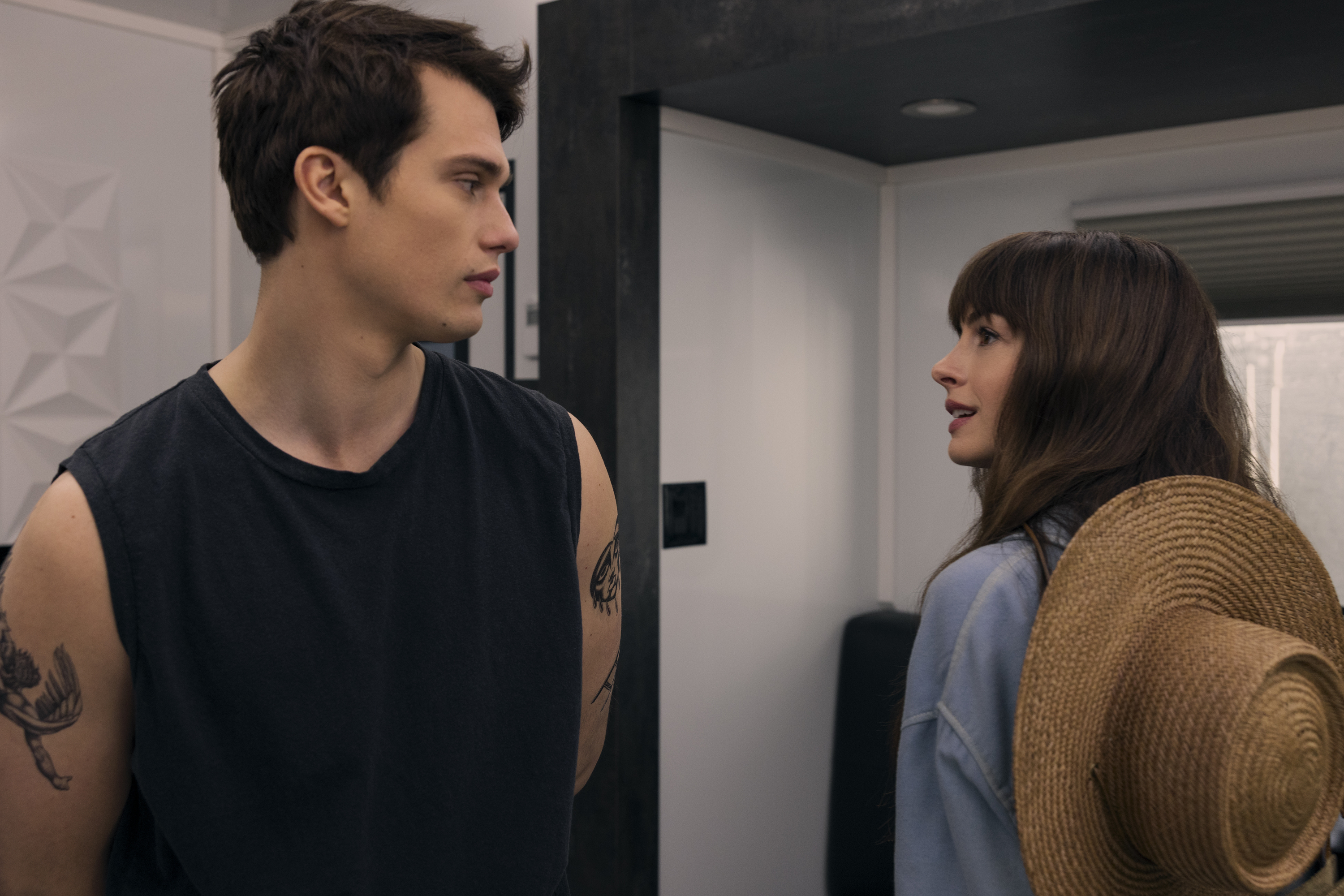 Hayes and Solène look at each other. This image is part of an article about The Idea of You ending, explained.