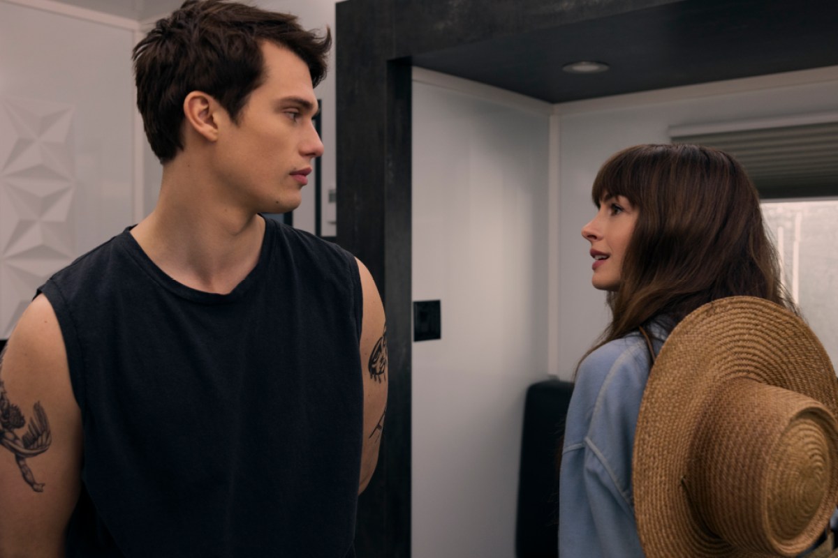 Hayes and Solène look at each other. This image is part of an article about The Idea of You ending, explained.