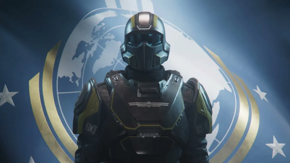 Helldivers 2, an armour-clad diver standing in front of a flag.