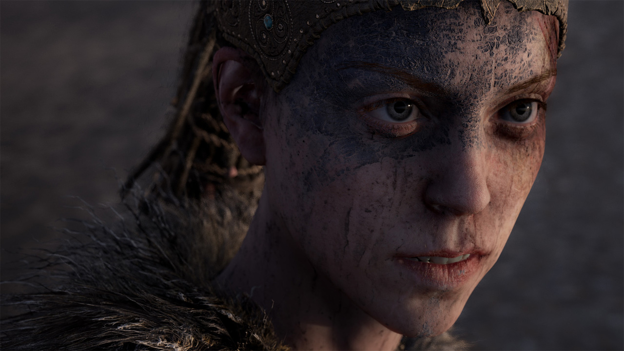 Senua in Hellblade: Senua's Sacrifice, a woman with a painted mask over her eyes and dirt on her face.