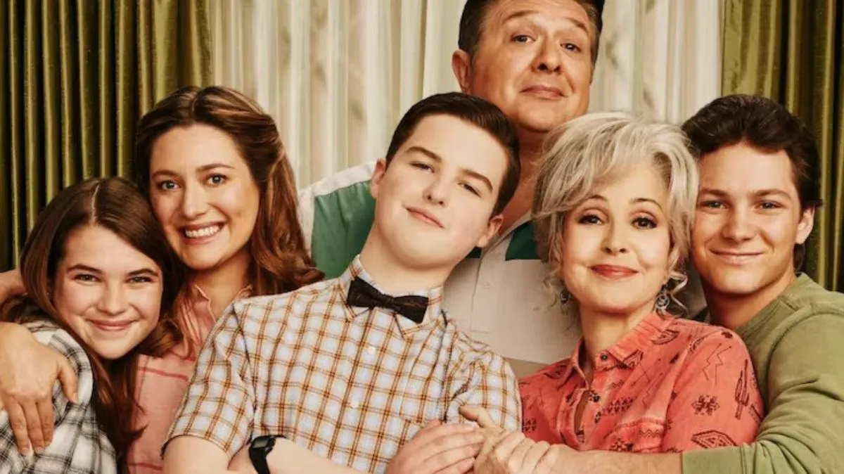 The cast of Young Sheldon holding each other.
