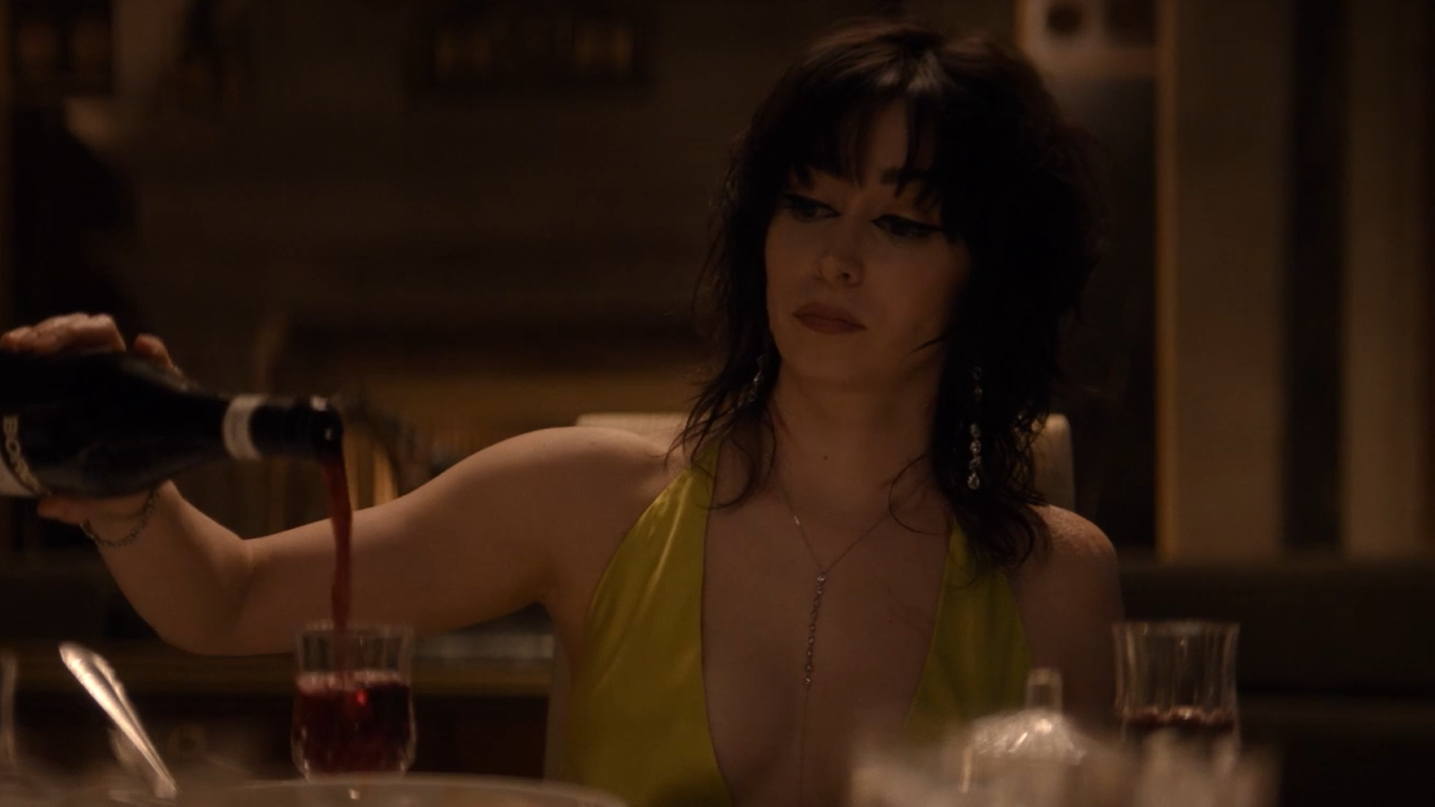 Sofia Falcone pouring a glass of wine in The Penguin Episode 4