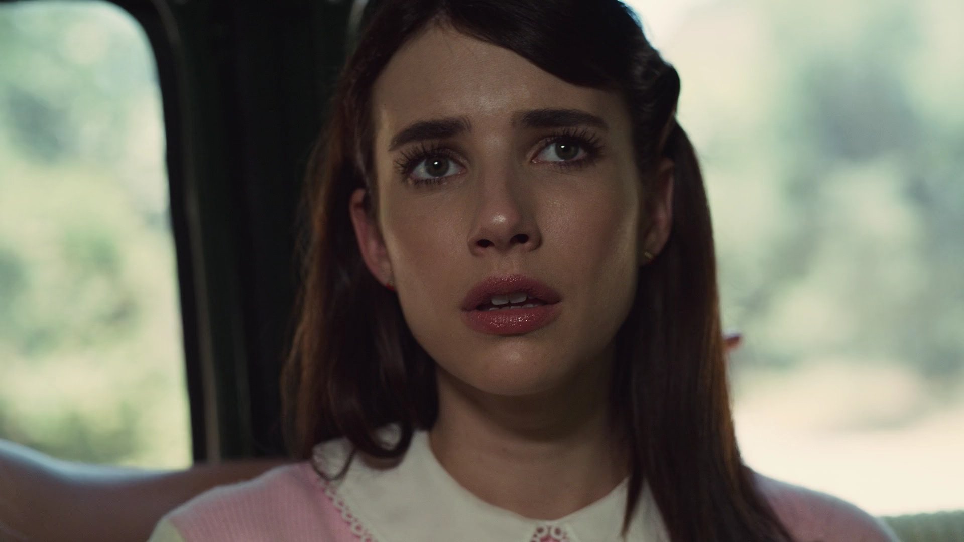 Brooke in the backseat of a car in American Horror Story