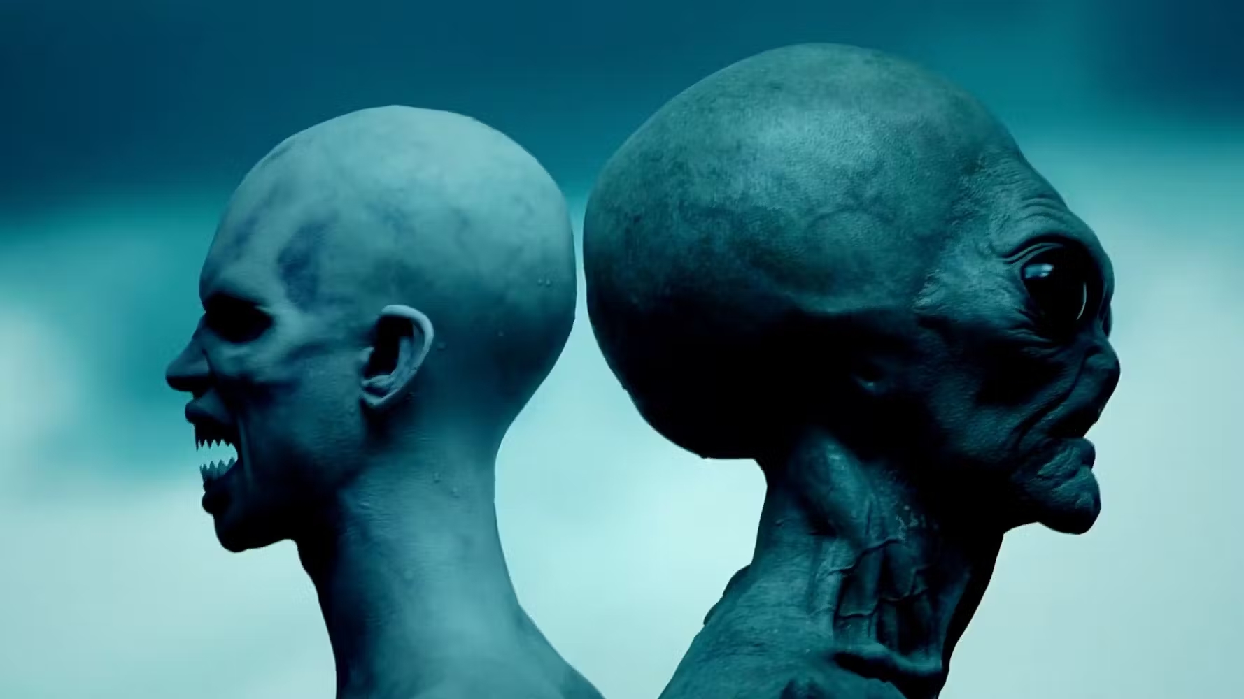 A sea monster and alien stand next to each other in American Horror Story