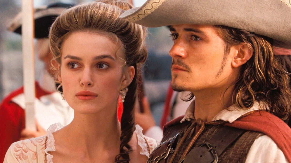 Orlando Bloom as Will Turner and Keira Knightley as Elizabeth Swan in Pirates of the Caribbean