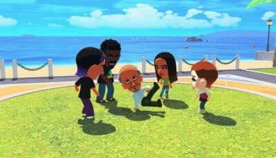 Animated Tomodatchi characters gather on grass by the beach, one old man joyfully dancing while others watch. The scene is vibrant and playful.