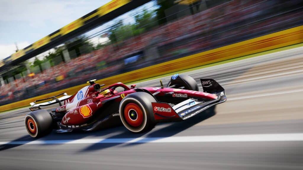 A red Ferrari Formula 1 car speeds through a track in F125 with motion blur.