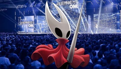Image of a large audience facing a stage with "gamescom ONL" on screens. In the foreground, a character with a white mask and red cape holds a needle-like weapon