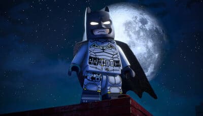 Lego Batman minifigure standing on a rooftop with the moon in the background