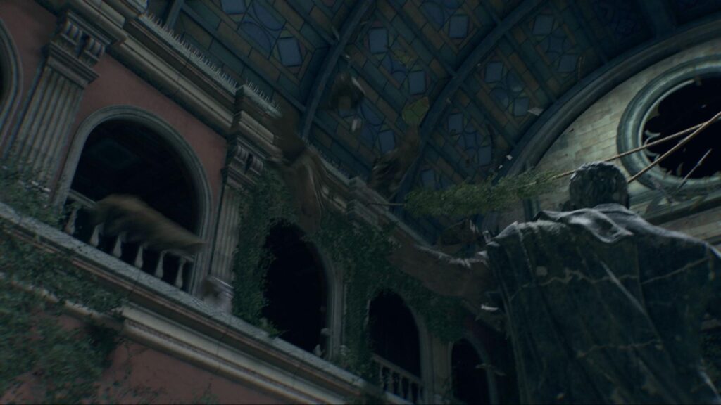 Broken stained glass ceiling and statue inside cathedral
