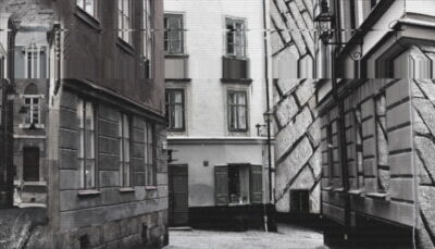 Glitched black-and-white view of an empty street in Concierge game