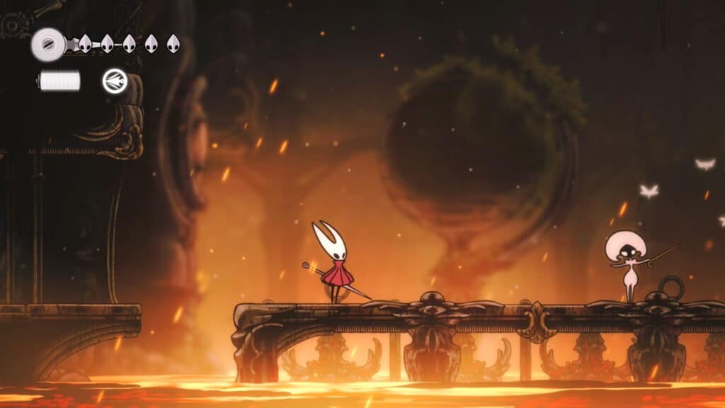 Hornet standing on a bridge over lava, preparing to fight an enemy.