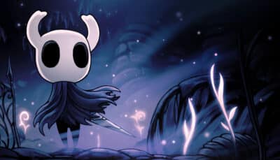 Hollow Knight hero exploring a dark glowing cave