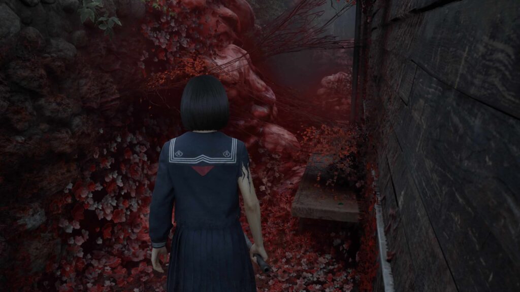 Hinako exploring a wall of grotesque red growths in Silent Hill f
