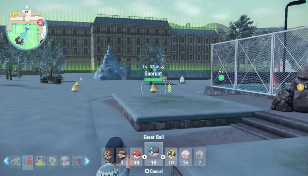 A player holds a Great Ball selection, with a large building in the background in Pokémon Legends: Z-A