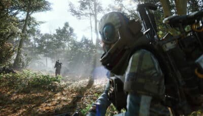Two soldiers equipped with futuristic gear scouting a misty forest in Arc Raiders