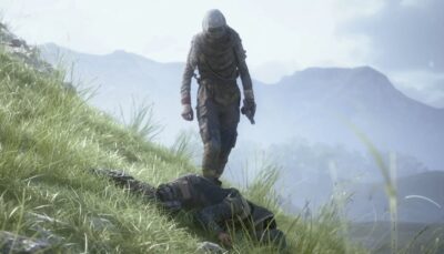 A player wearing tactical gear and a hood stands over a fallen opponent on a grassy hillside in Arc Raiders, with misty mountains in the background.