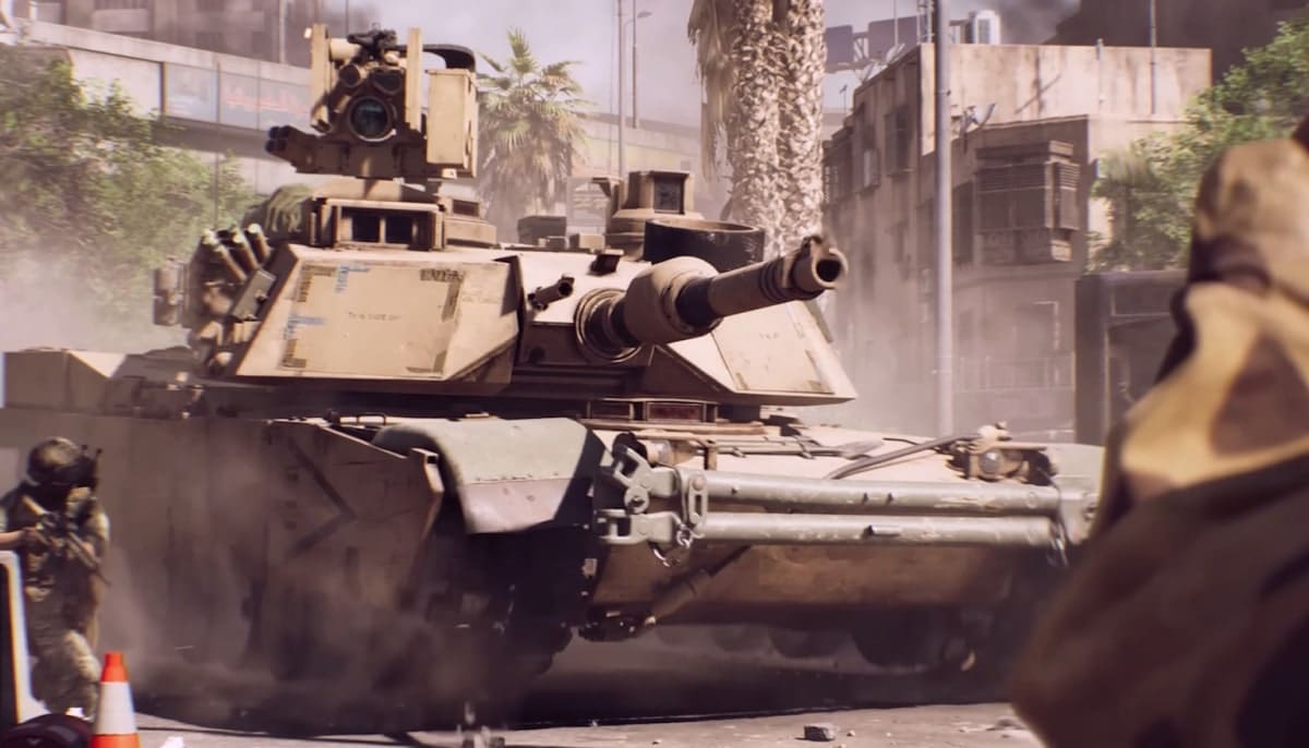 Heavy tank moving through a dusty city street with soldiers advancing nearby in Battlefield 6.