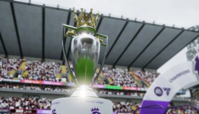 The Premier League trophy displayed in a packed stadium during a championship celebration in Football Manager 26.