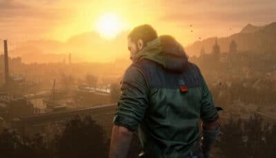 A person stands on a rooftop overlooking a sprawling city at sunset, with mountains in the distance in Dying Light