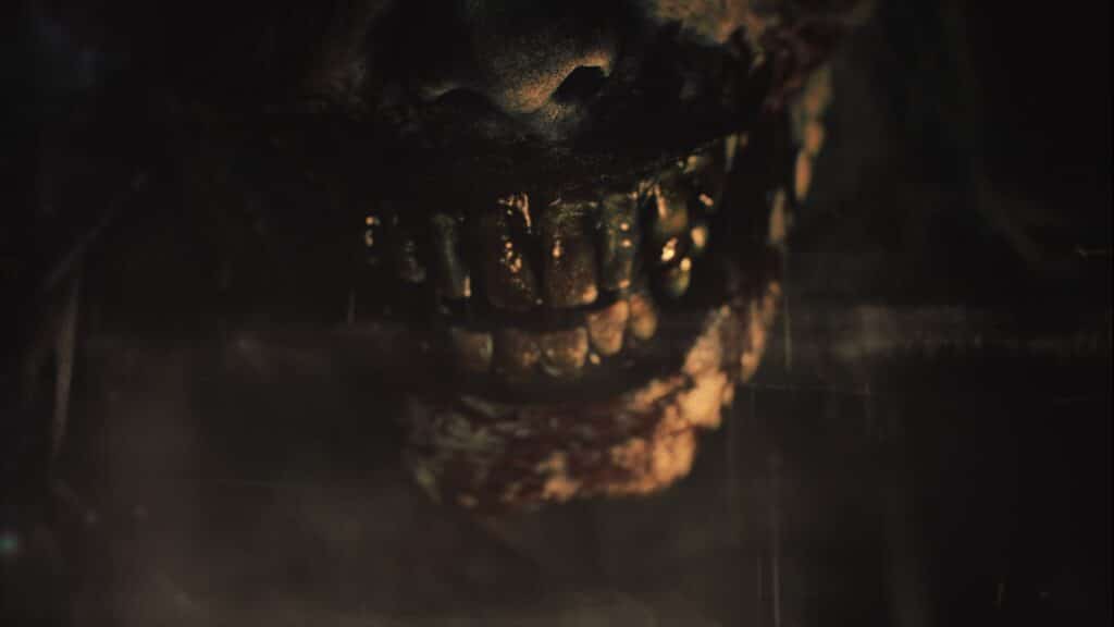 A terrifying close-up of a decaying zombie’s bloody mouth and teeth in Resident Evil