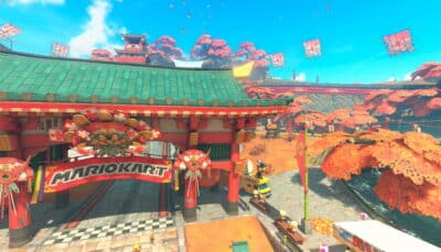 Mario Kart World track entrance with red gate and autumn trees