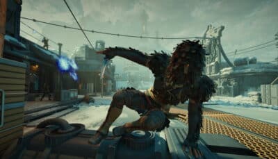 A figure in dark, feather-like armor crouches on a rooftop in a snowy industrial area, poised mid-action in The Outer Worlds 2