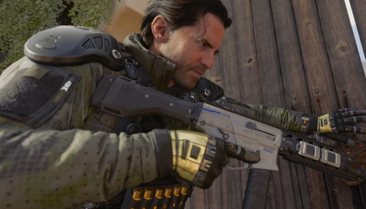 A soldier in tactical gear aims a futuristic rifle while taking cover against a wooden wall in Call of Duty: Black Ops, shown in a close-up action shot