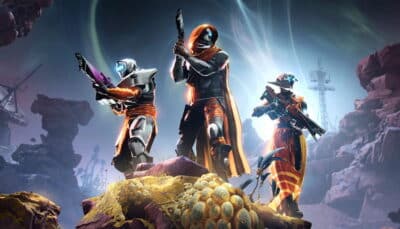 Three armored sci-fi warriors with weapons stand on rocky terrain under an aurora-lit sky in Destiny 2
