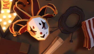 A jester-style mask from This Ain’t Even Poker, Ya Joker lying on a cluttered tabletop with ropes and circus-themed props around it
