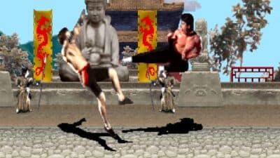 Mortal Kombat characters fighting in battle with statues behind them.