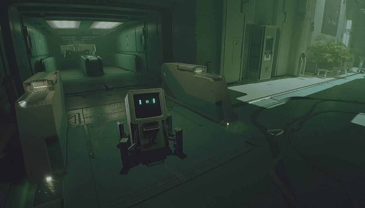 A small robot stands alone in a dimly lit space station hallway in Routine