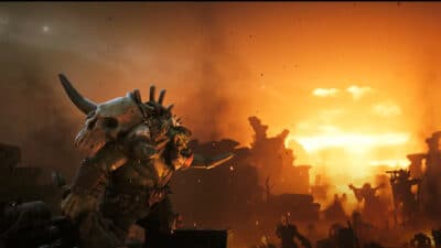 Image of an orc starting off into a distant bomb going off from Warhammer 40k.