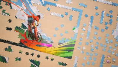 Colorful puzzle pieces form a dynamic cyclist illustration inspired by video games