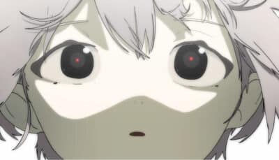 A child stares ahead with glowing eyes in Children’s Garden as soft light washes over their face