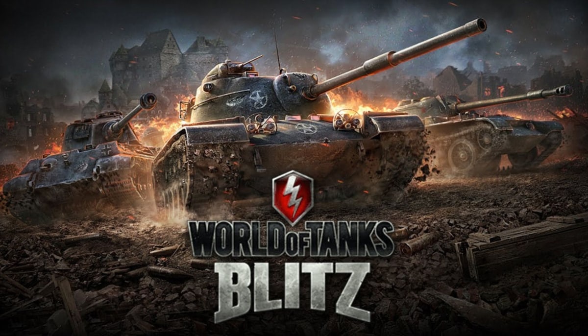 A group of tanks advances through fire and rubble during a large scale battle in World of Tanks Blitz