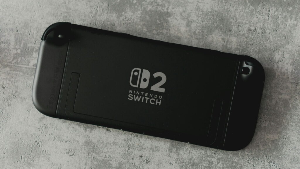 A Nintendo Switch 2 console rests on a concrete surface as a simple gaming gift option