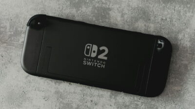 A Nintendo Switch 2 console rests on a concrete surface as a simple gaming gift option