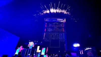 Fireworks erupt above a massive stage during the Tetris World Finals