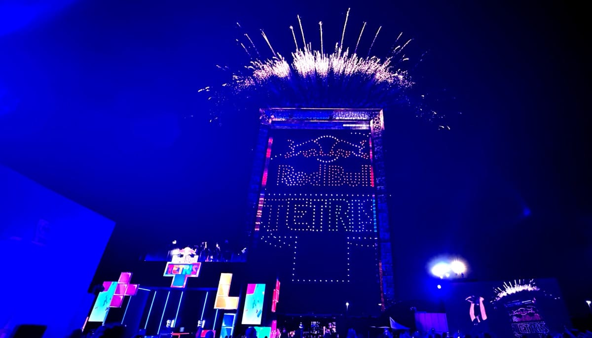 Fireworks erupt above a massive stage during the Tetris World Finals