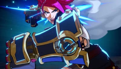 A pink haired fighter lunges forward while unleashing a glowing punch with massive gauntlets in 2XKO