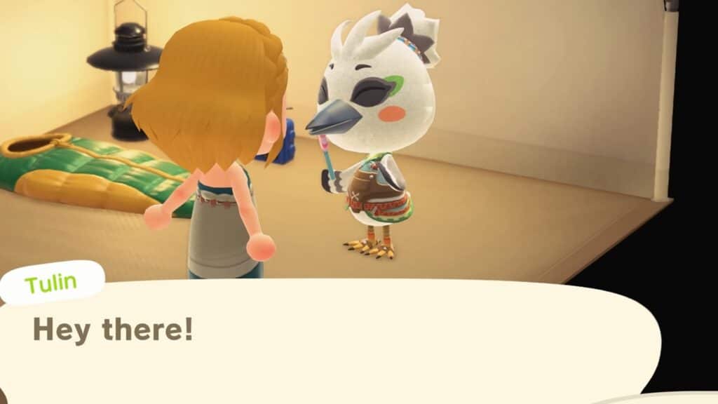 Animal Crossing New Horizons shows the villager Tulin greeting the player during a friendly indoor visit