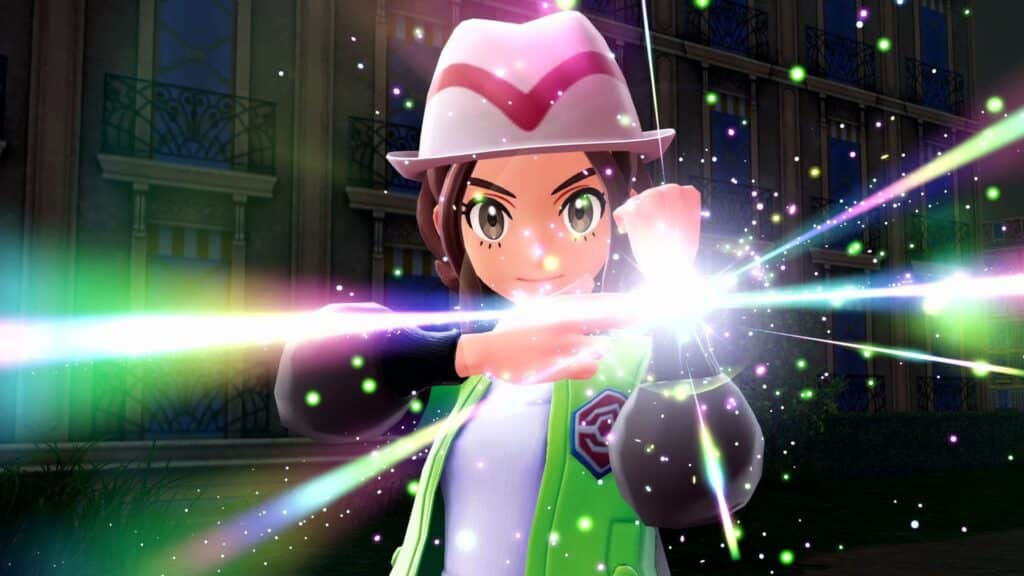 A Pokémon trainer channels a glowing attack in Pokémon Sword and Shield during an intense battle scene at night