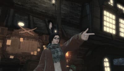 Final Fantasy XIV Online character points confidently inside a wooden tavern illuminated by warm lights