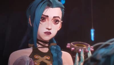 A close up scene from Arcane shows Jinx looking vulnerable while holding a mechanical object