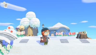 Animal Crossing New Horizons features a character holding a ladder while standing in a bright snowy village plaza